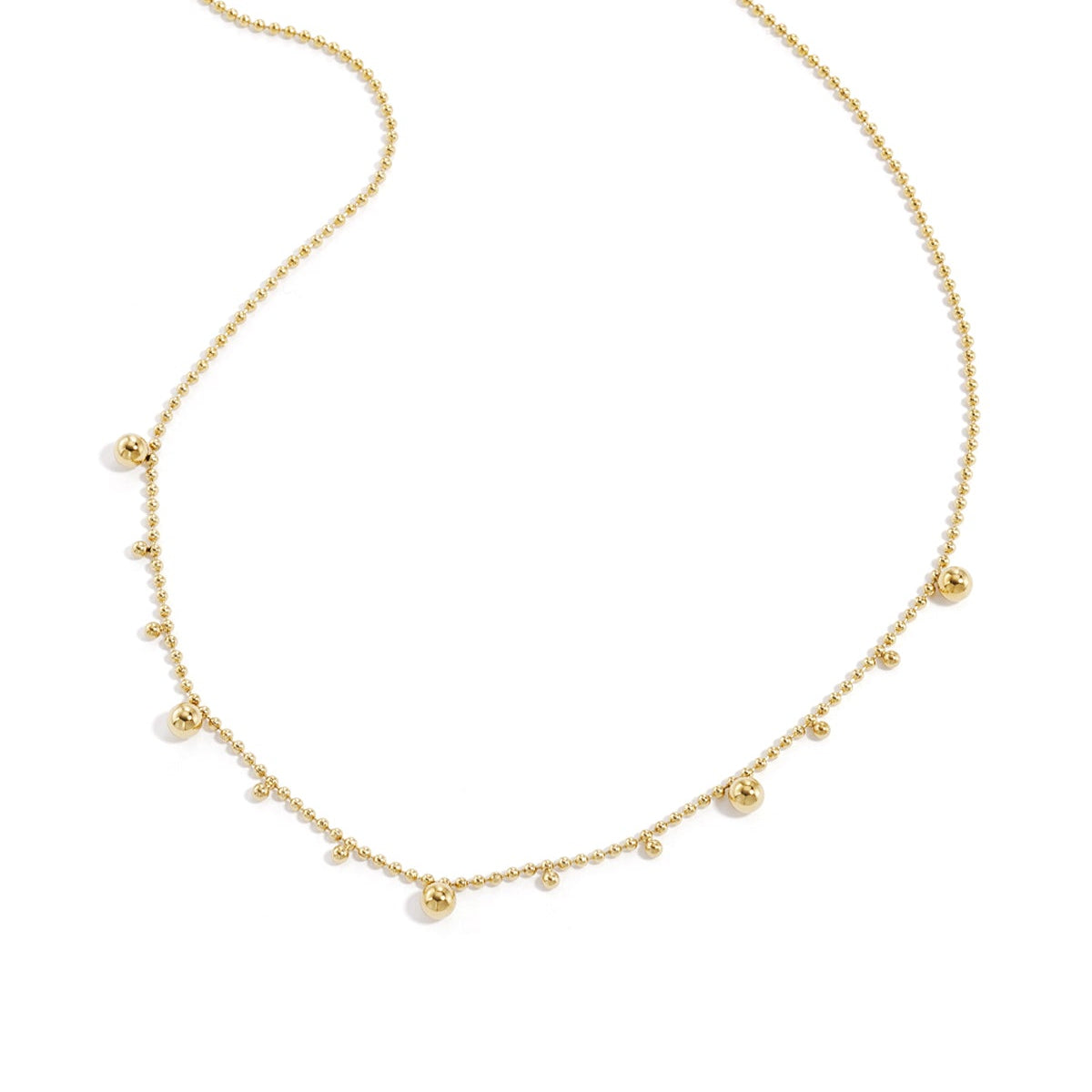 Necklace with alternating balls