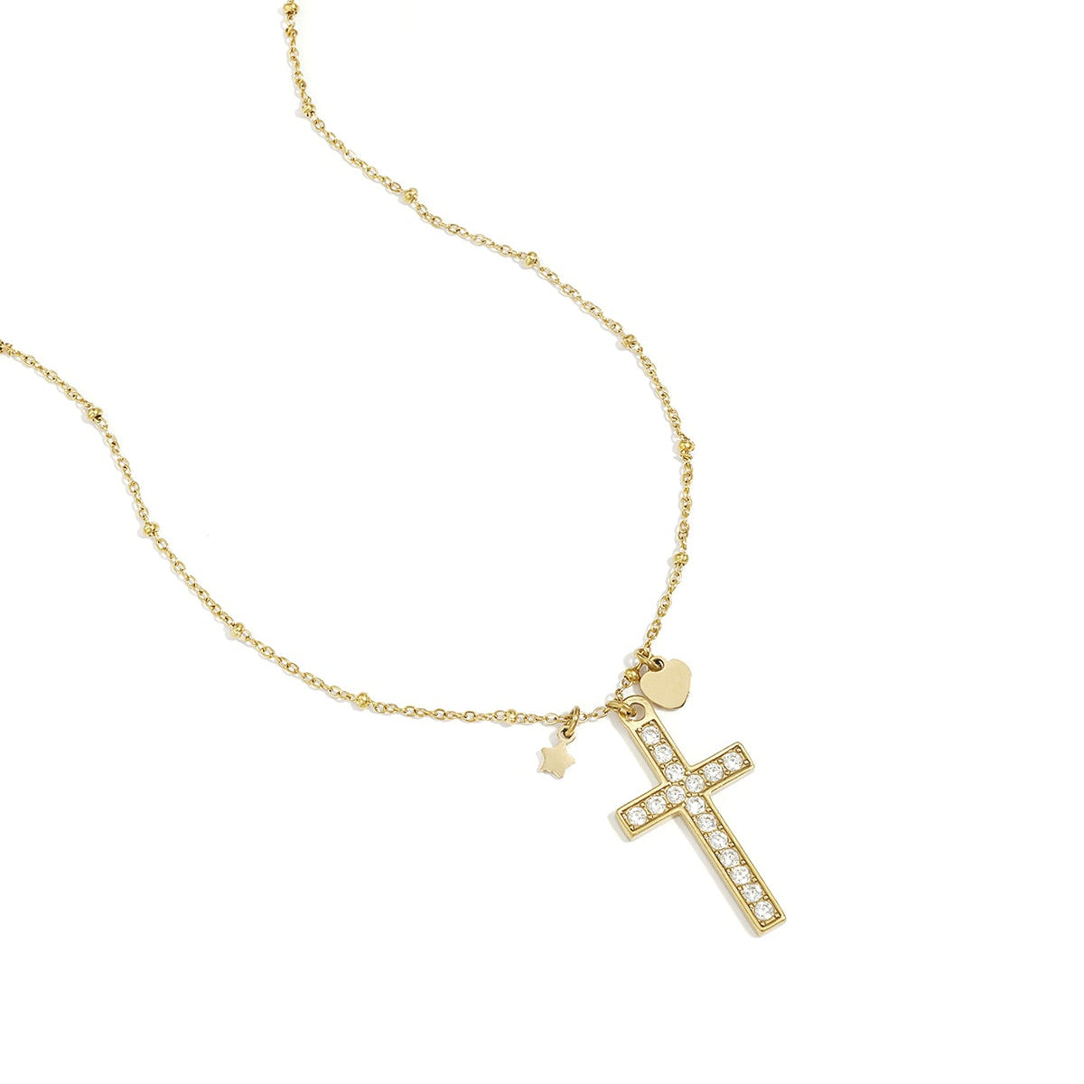 Necklace with decorated cross pendant and charms