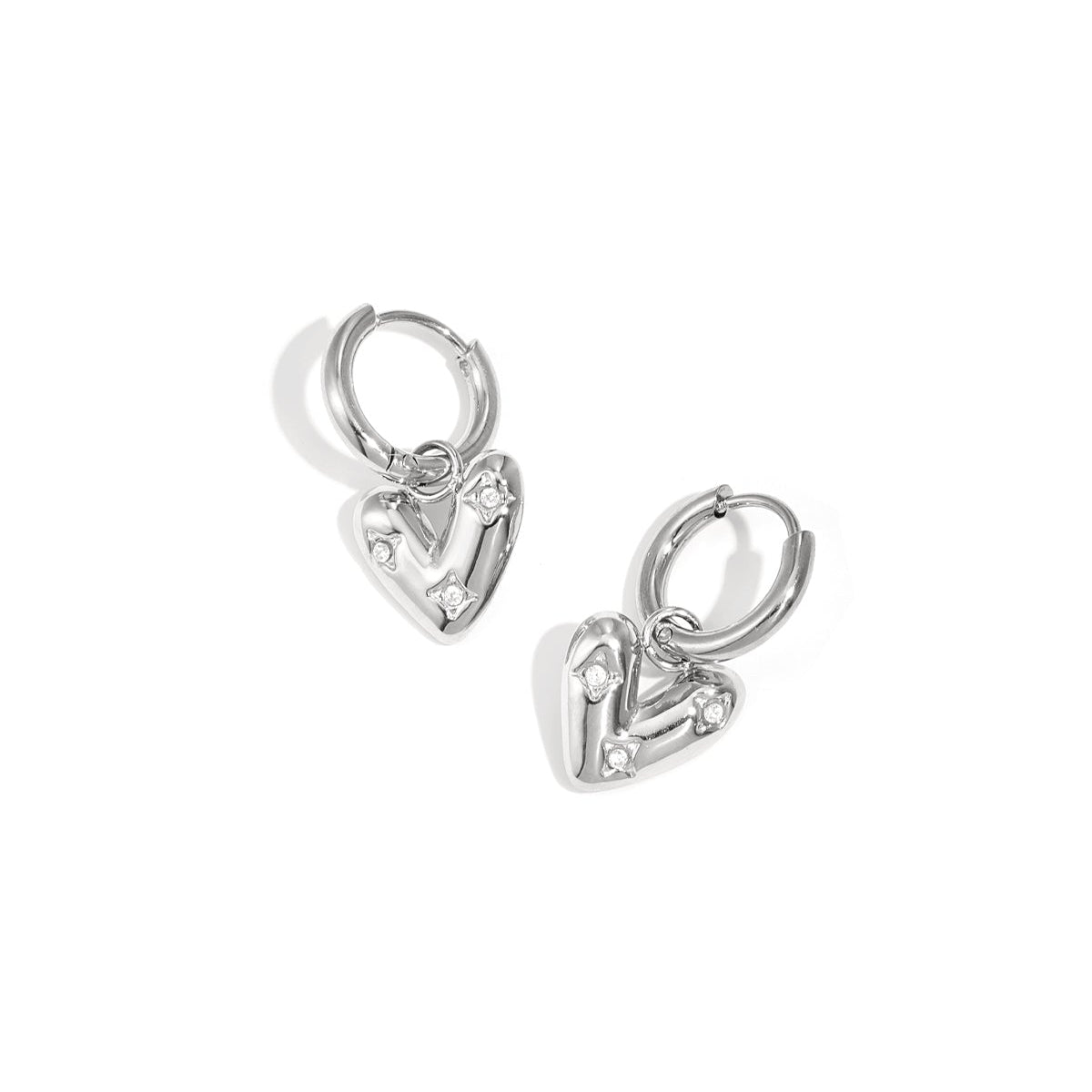 Earrings with heart-shaped pendant and zircon