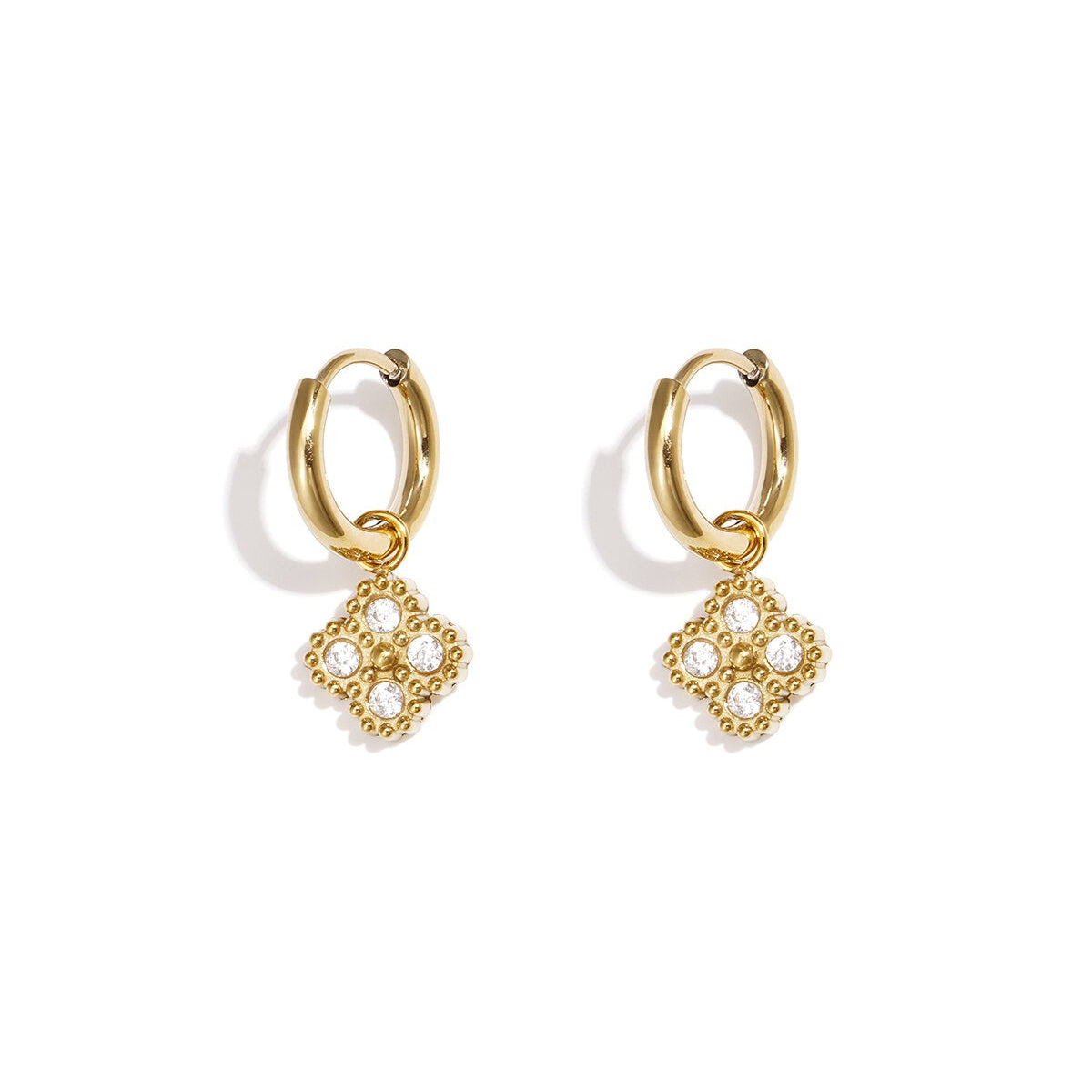 The clover hoop earrings | gold crystal clover charm huggie hoops